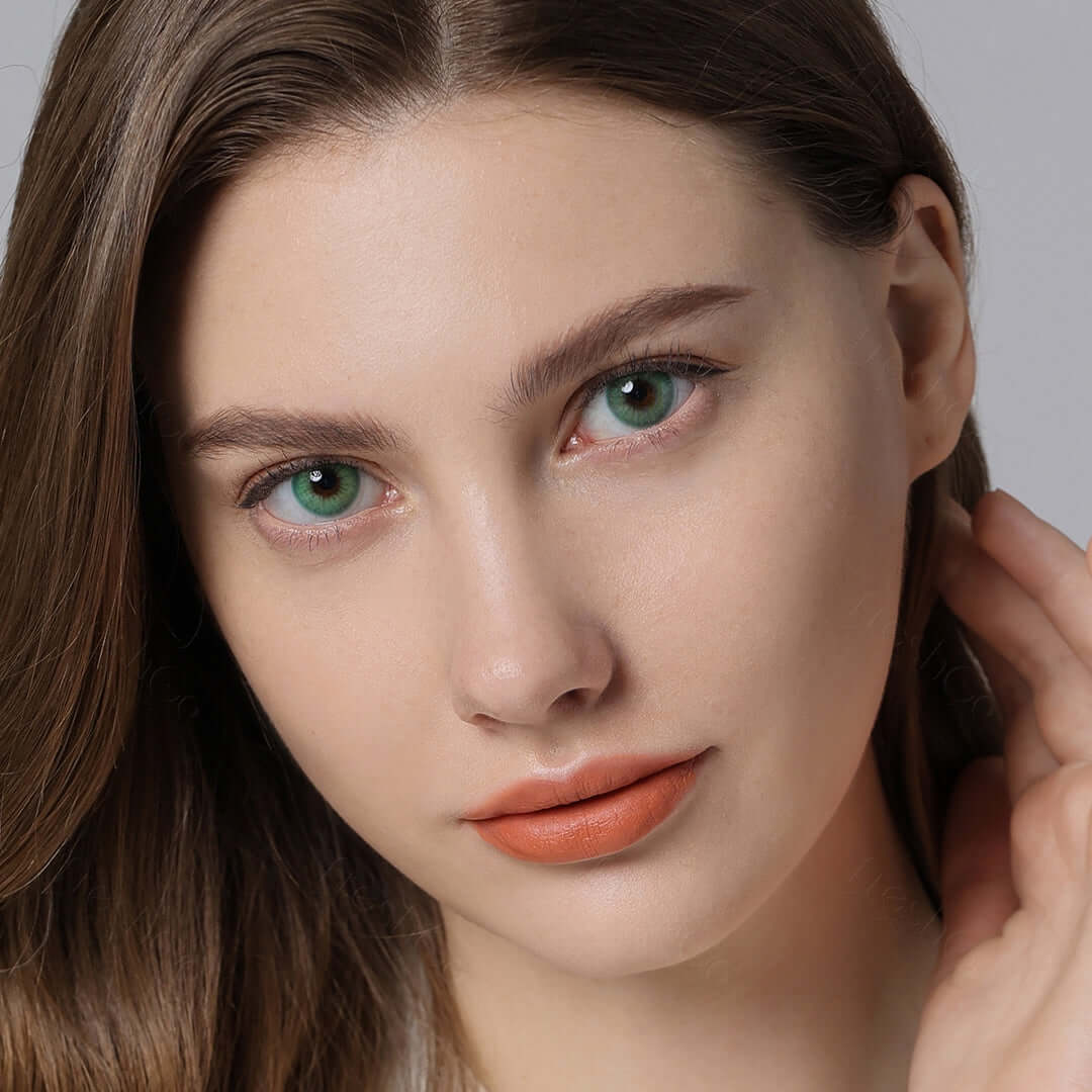 Emerald green contact lenses on brown eyes