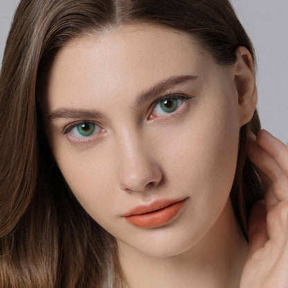 Emerald green contact lenses on brown eyes